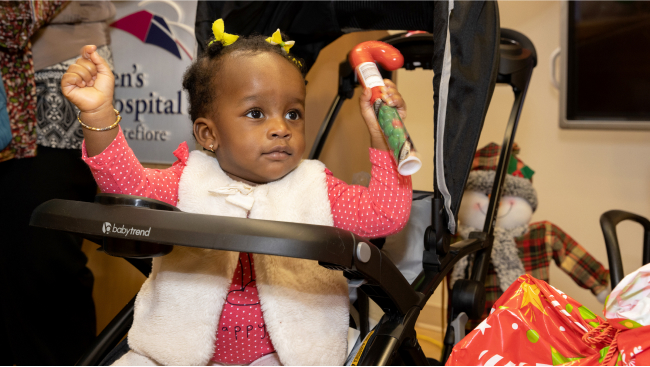 A toddler having a good time at the event