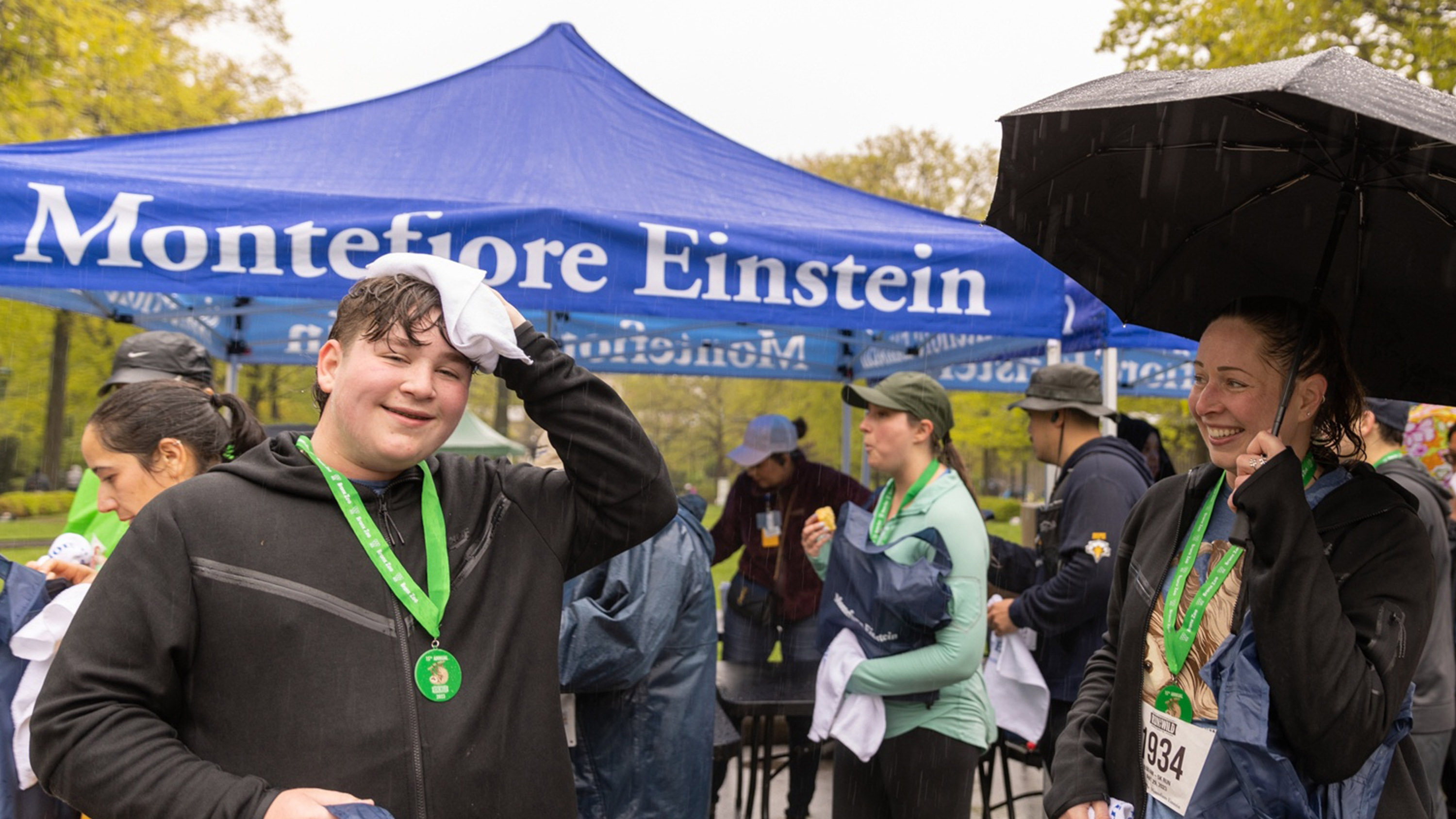 A runner dries off after completing the Run for the Wild.