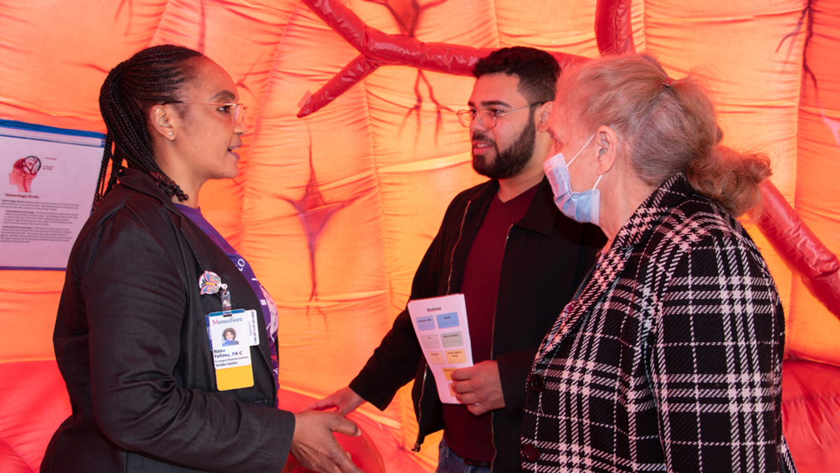 Staff and participants meet inside the special event pavilion for stroke awareness and prevention.