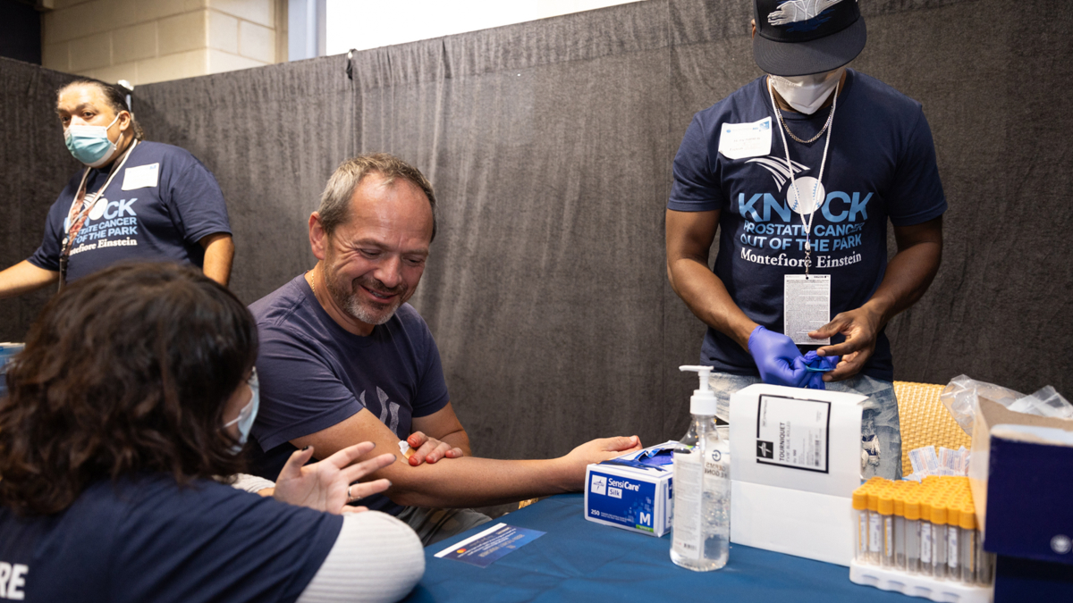 A brave participant gets test samples taken.