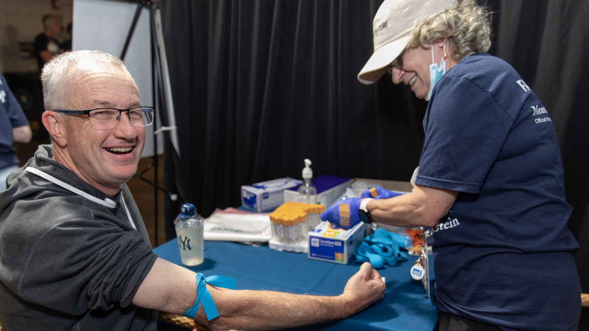 A brave participant gets test samples taken.