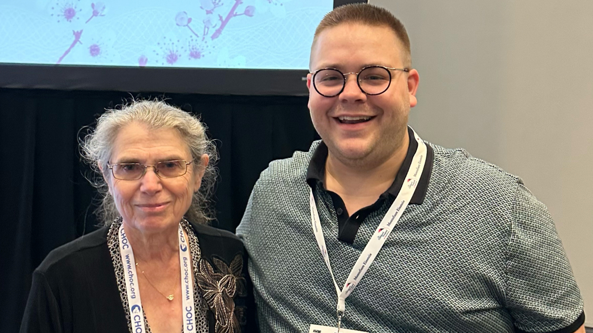 Two smiling attendees at the conference.