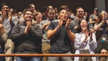 Students react enthusiastically to news of the gift of free tuition.